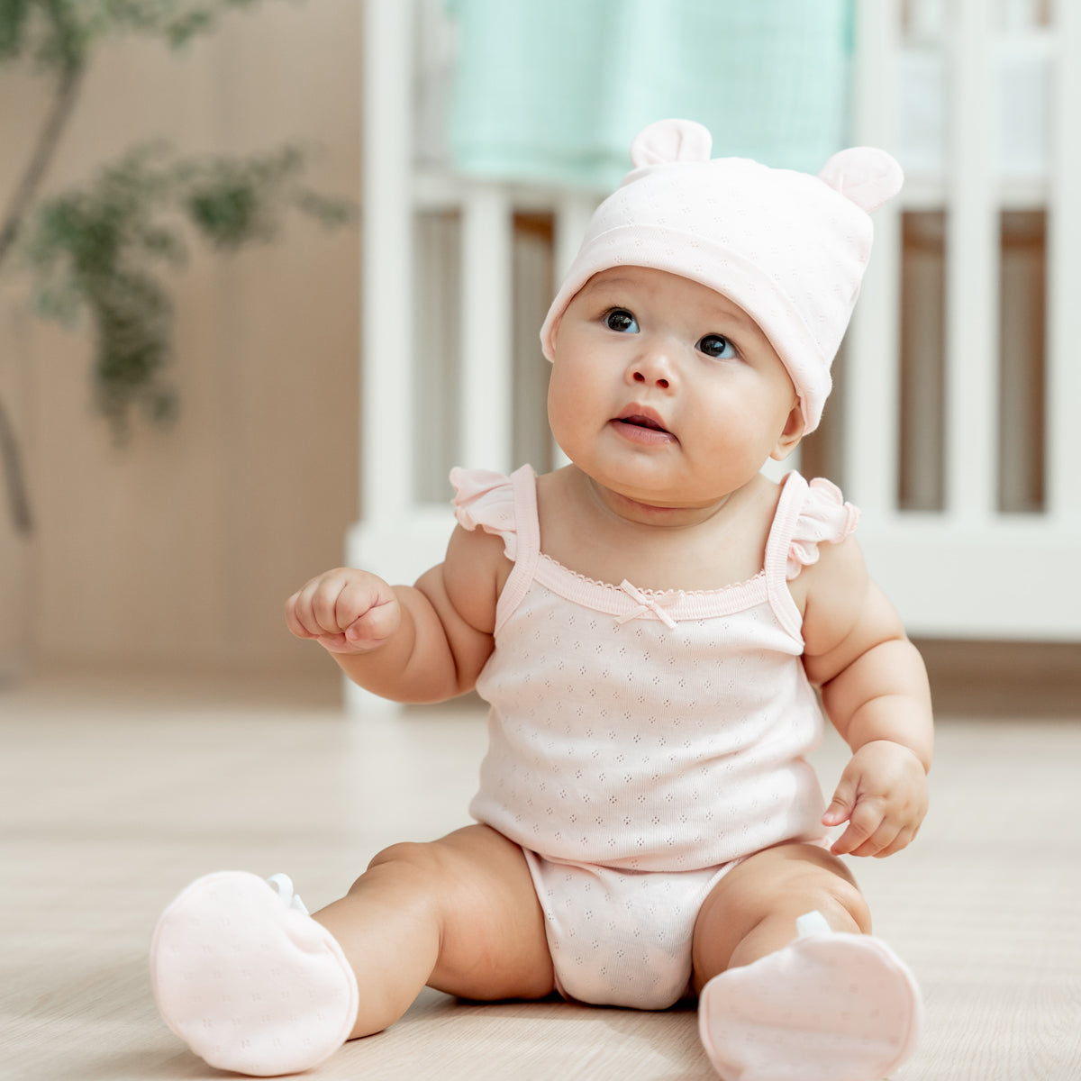 Organic Baby Ruffle Strap Romper in Pink by Le Petit Society — image 7