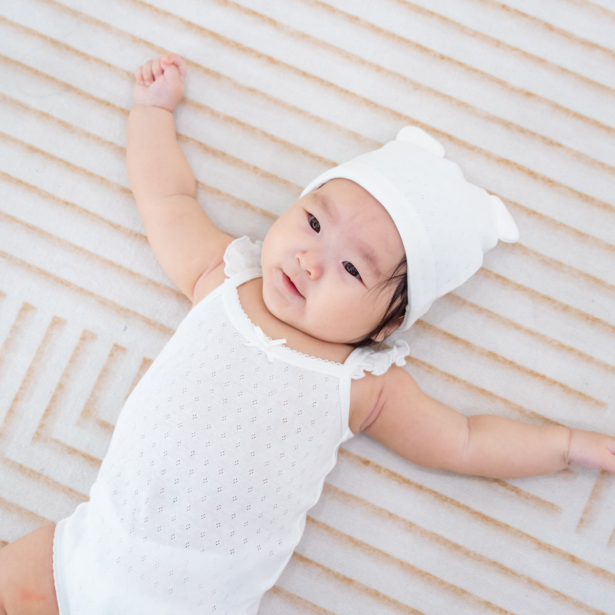 Organic Baby Ruffle Strap Romper in White by Le Petit Society — image 8