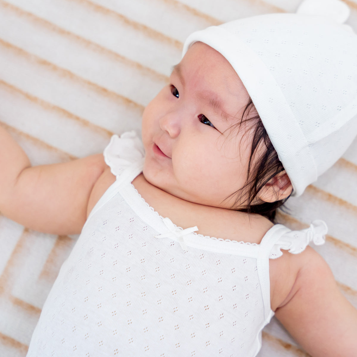 Organic Baby Ruffle Strap Romper in White by Le Petit Society — image 4