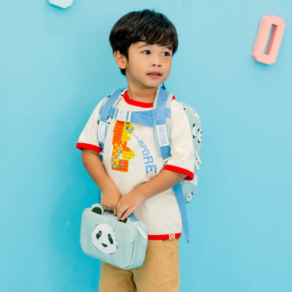 A preschool boy carrying a mint green school bag and pencil case with panda print. 