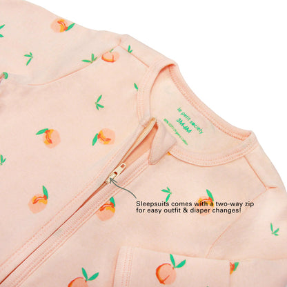 An infographic demonstrating the two-way zipper of a coral pink baby zip sleepsuit, and its function of providing an easy access to outfit and diaper changes.