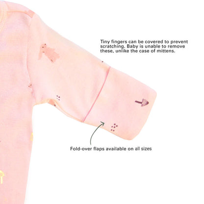 An infographic showing the mittens of an organic baby zip sleepsuit, which come with fold over flaps to cover a baby's hands and keep them warm.