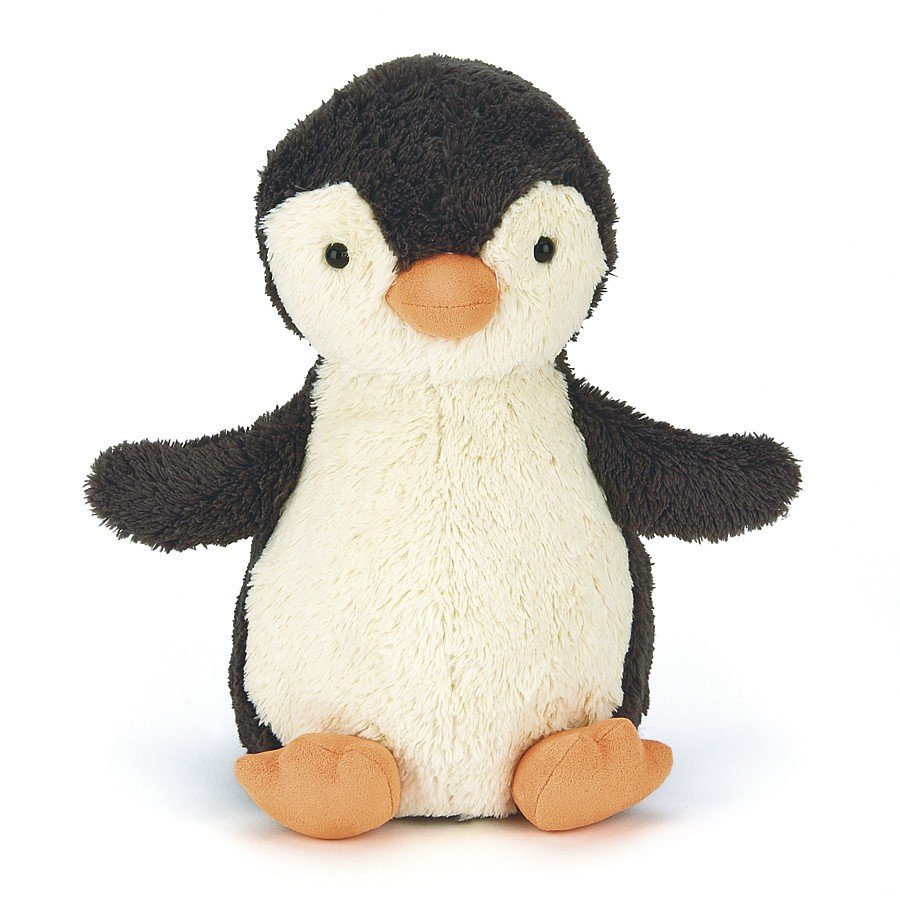 A front view of a small cute plush penguin toy with a black back, white belly and face, orange beak, and orange feet, sitting upright against a plain white background.