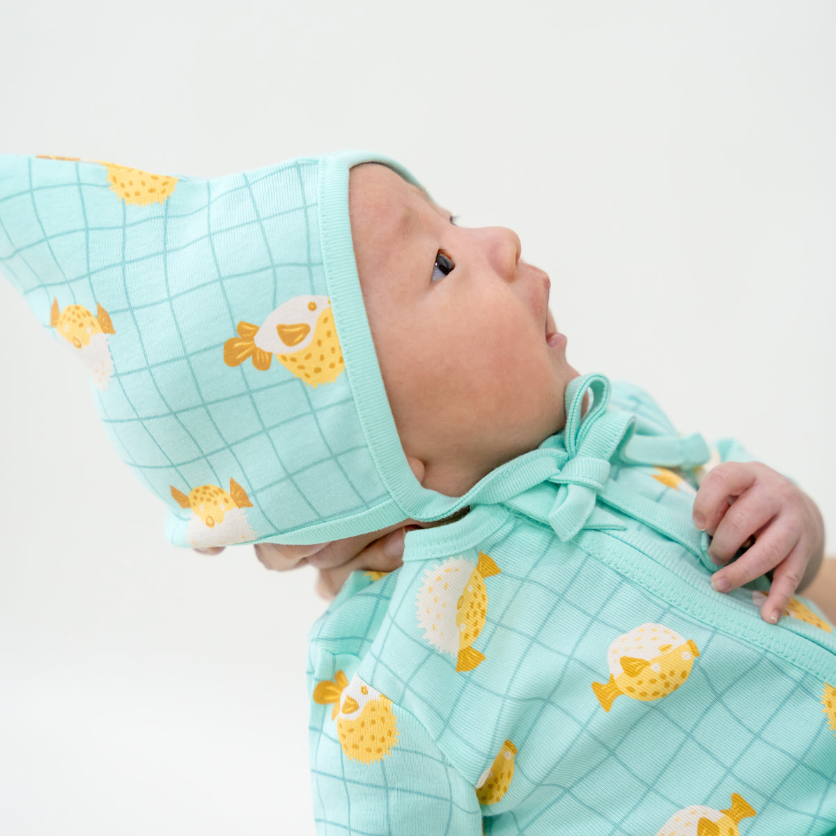 Organic Baby Bonnet Hat in Puffer Fish Print by Le Petit Society