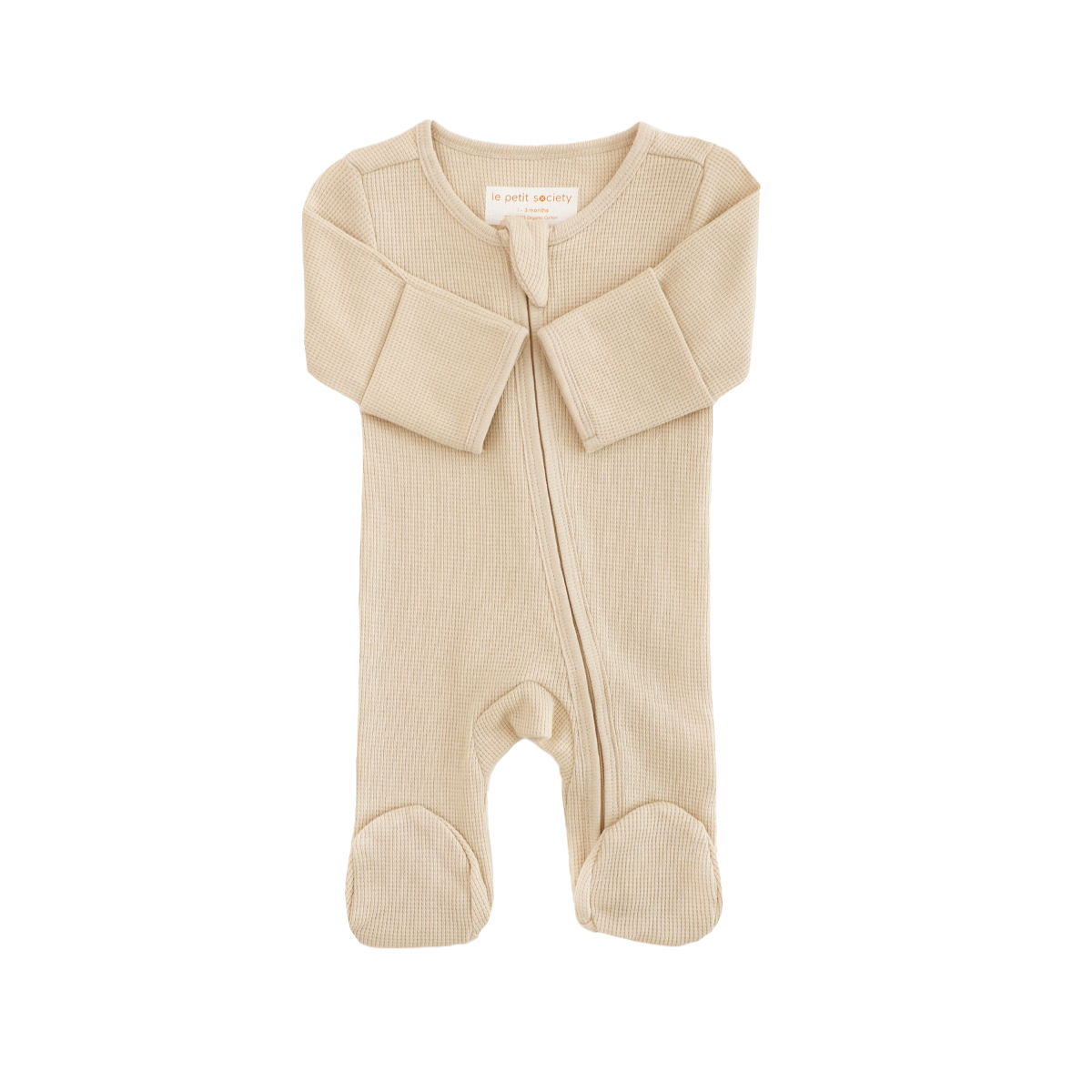 An organic baby zip sleepsuit in beige by Le Petit Society.
