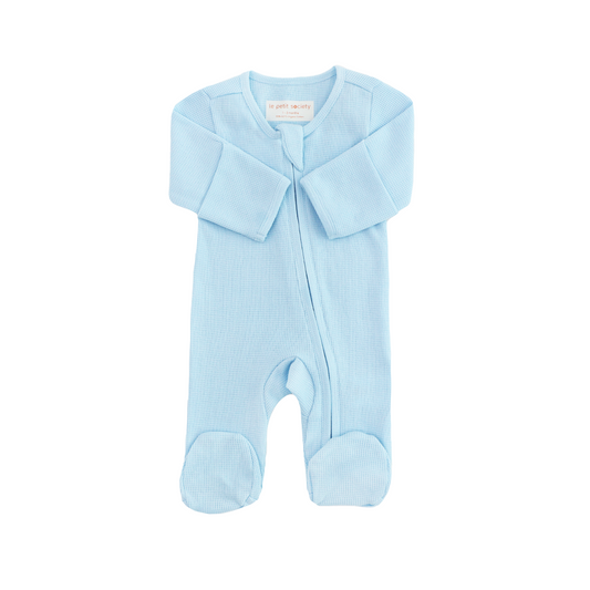 An organic baby zip sleepsuit in blue by Le Petit Society.
