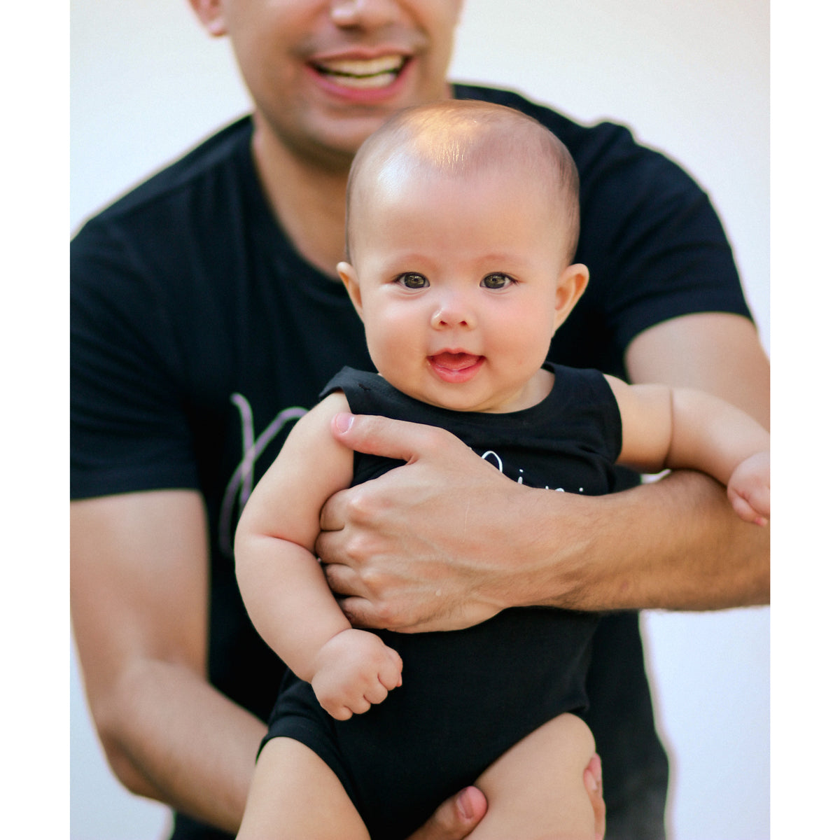 Family Tees - Mini Baby Sleeveless Romper in Black by Le Petit Society — image 2