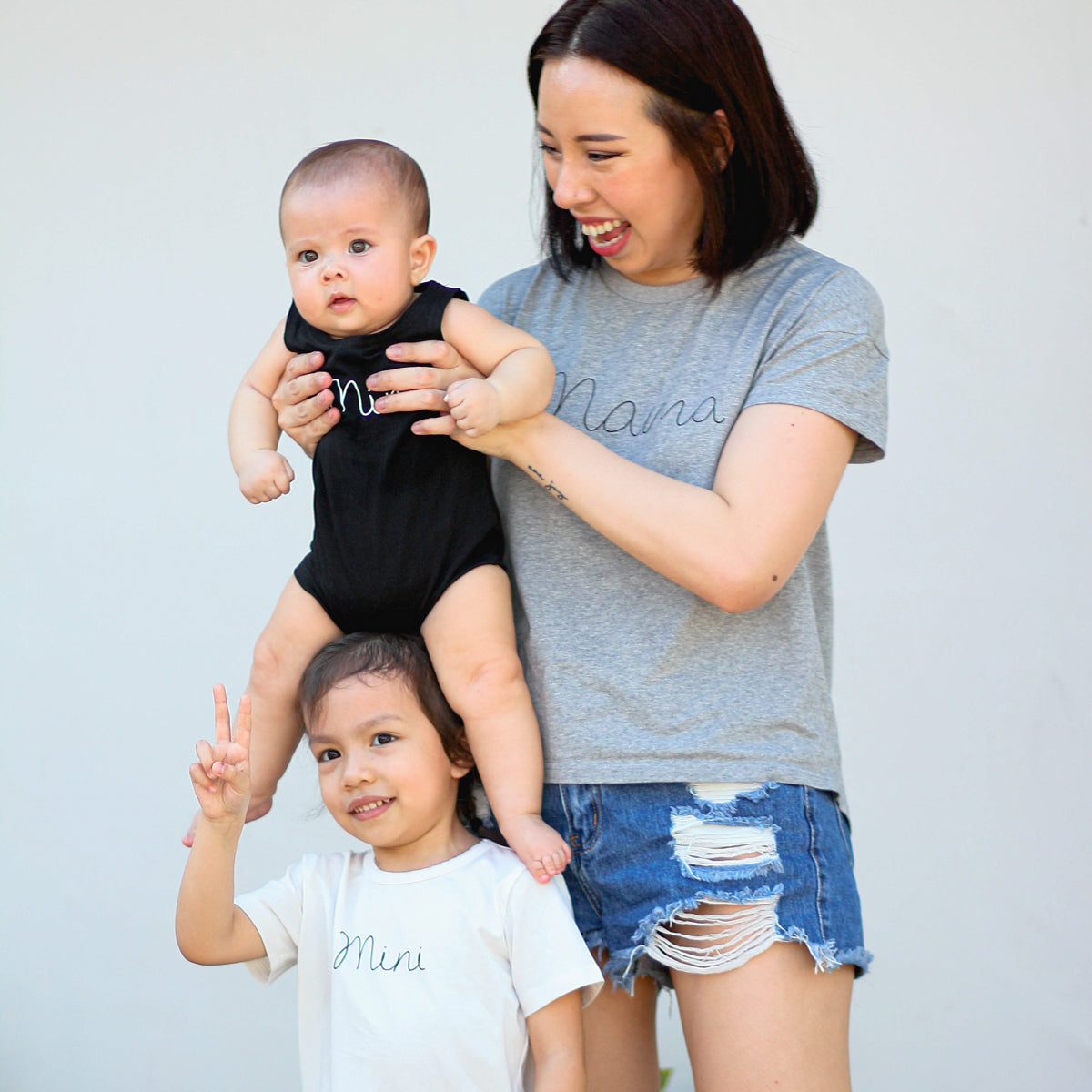 Family Tees - Mini Baby Sleeveless Romper in Black by Le Petit Society — image 5