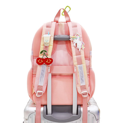 The shoulder straps of the double pocket school bag are customisable with sticker patches.