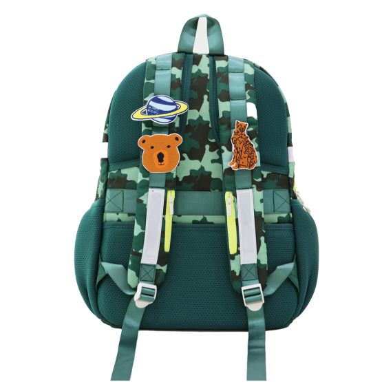 The shoulder straps of a Le Petit Society school bag customised with velcro patches.