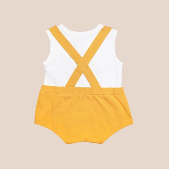 An animal-themed baby romper by Le Petit Society, featuring a lion's face at the front, complete with bottoms and cross back straps in yellow-orange.