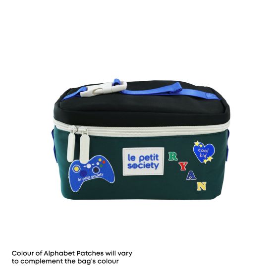 Le Petit Society's black and green thermal lunch bag personalised with sticker patches.