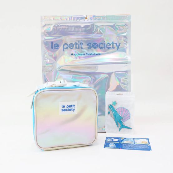 Le Petit Society's customisable party pack, with a blue and silver thermal lunch bag and an ocean-themed sticker patches.