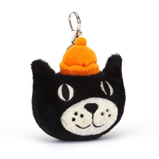 A front view of a plush black cat face keychain with embroidered eyes, white snout, and smiling expression, topped with a bright orange hat