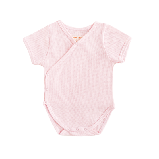 A baby organic kimono romper in pink by Le Petit Society.