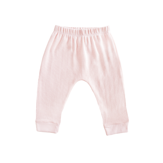 A pair of organic baby leggings in pink by Le Petit Society.
