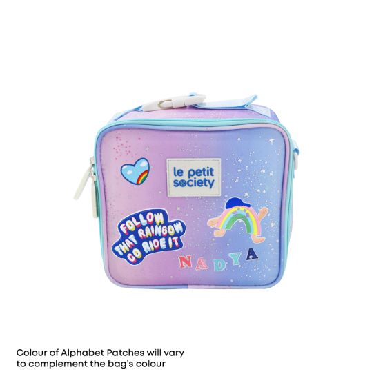 A mini lunch bag from Le Petit Society, customised with sticker patches.