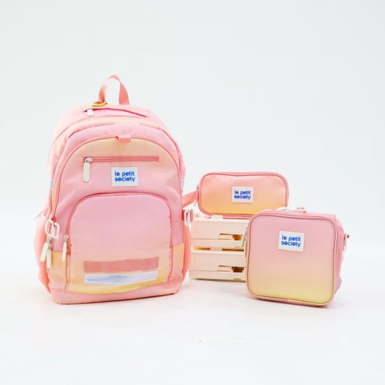 The LPS kids essential school bundle in a pink and yellow ombre, consisting of a school bag, mini lunch bag and pencil case.