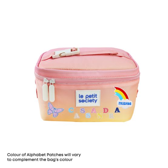 Le Petit Society's pink thermal lunch bag personalised with sticker patches.